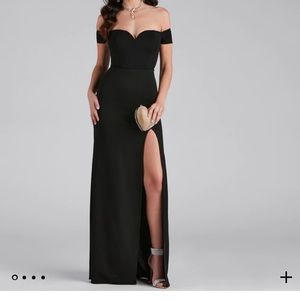 Long black formal dress with high slit.